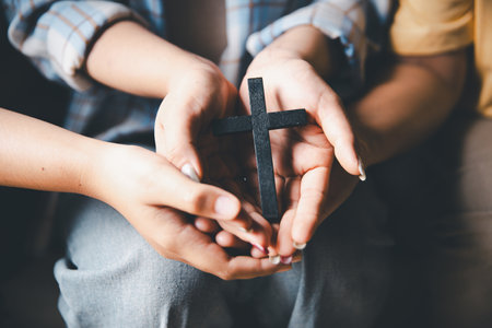 247237371 close up group of hands pray with spiritual faith on holy bible in church religion worship prayer