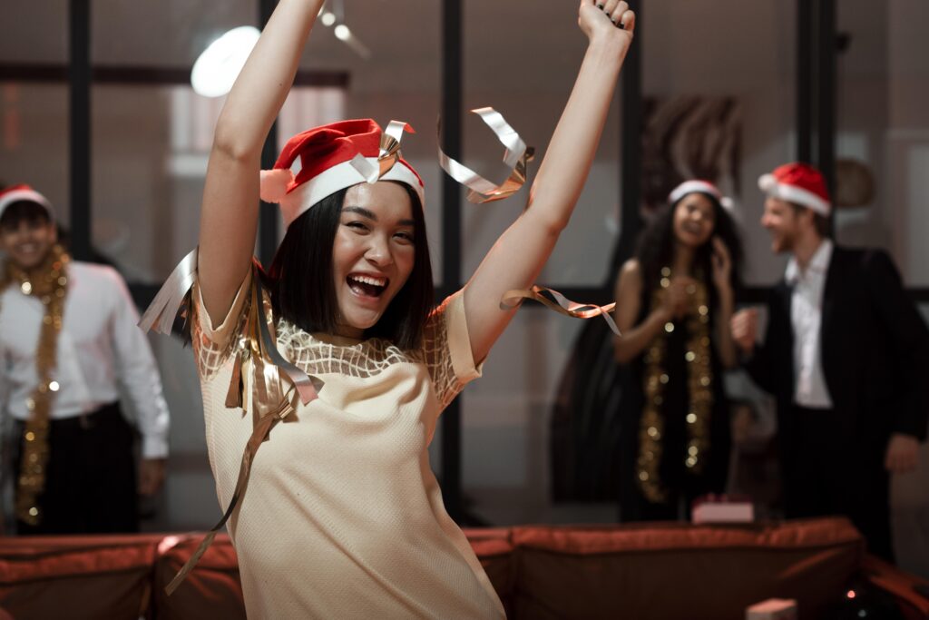 woman wearing santa s hat partying