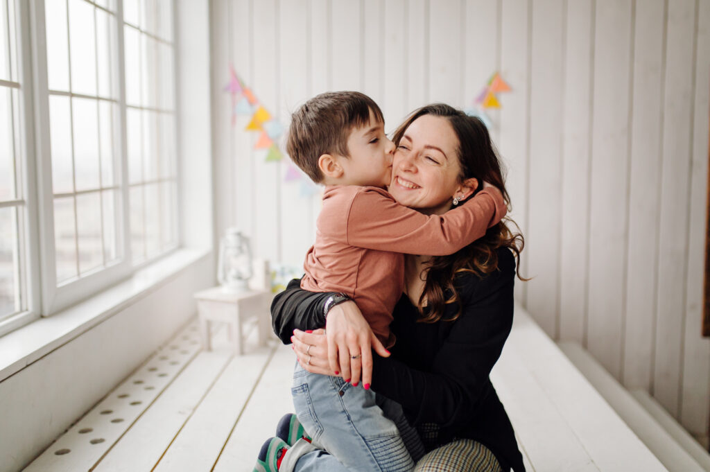 mother her son are posing studio wearing casual clothes